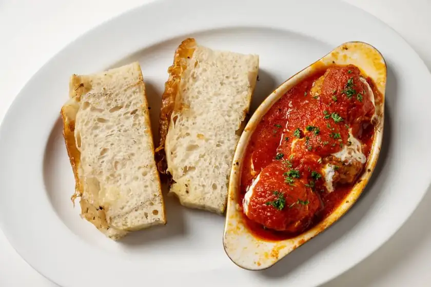 Baked meatballs in pomodoro sauce with toasted focaccia