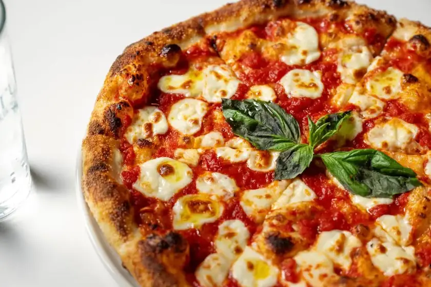 Margherita pizza with fresh mozzarella, tomato sauce and basil